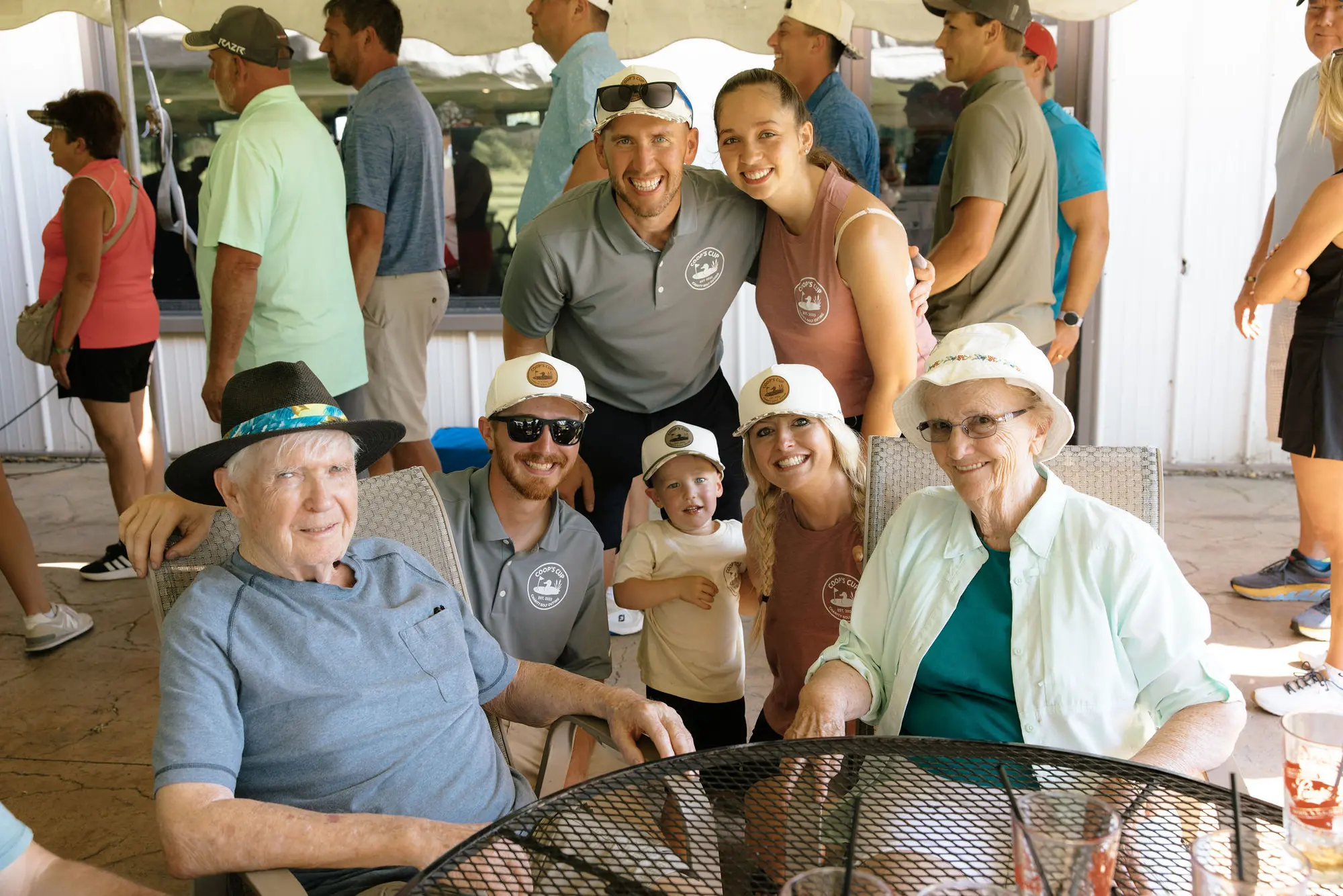 Guests share a light moment after golf