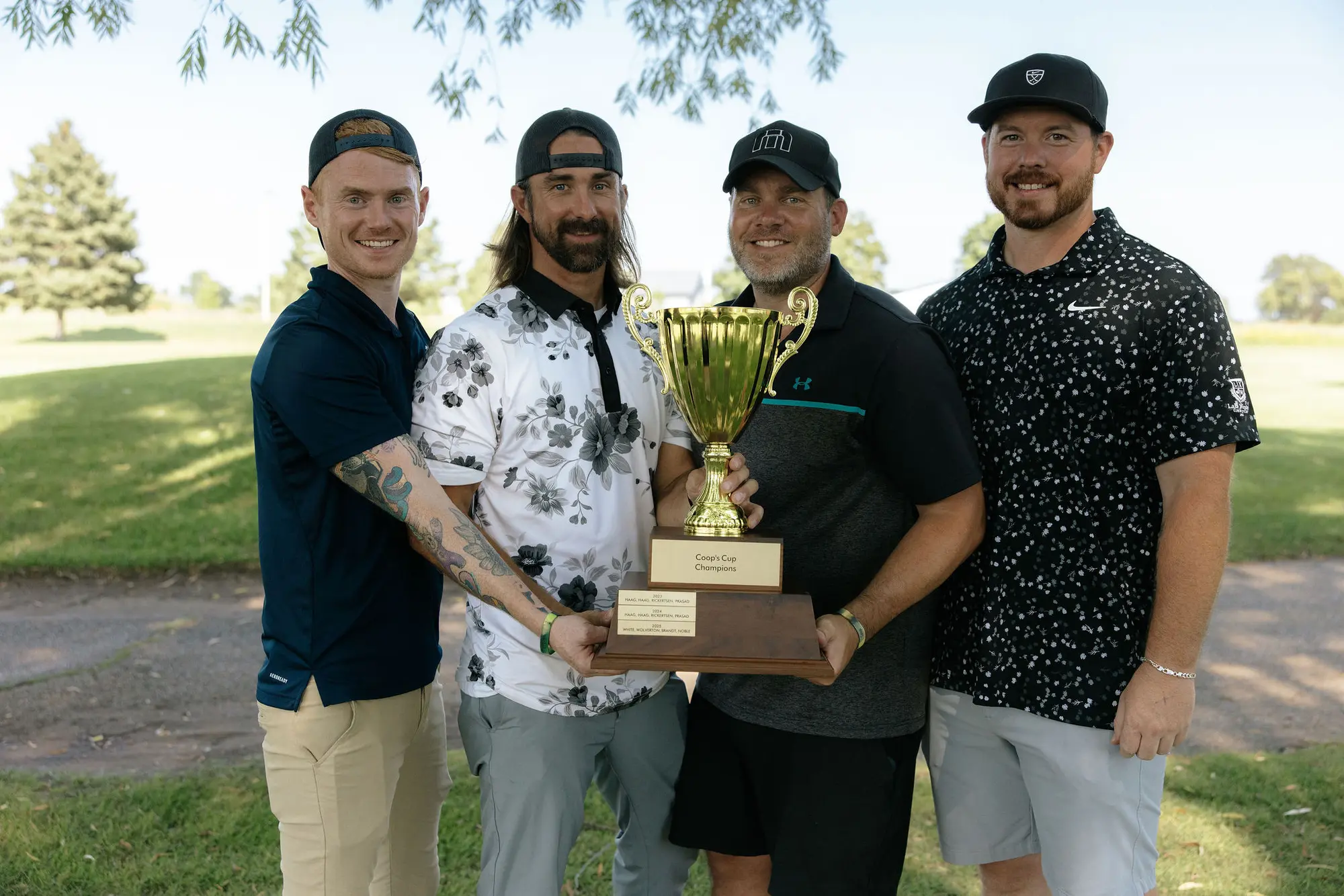 The 2026 champions hold the Coop's Cup trophy