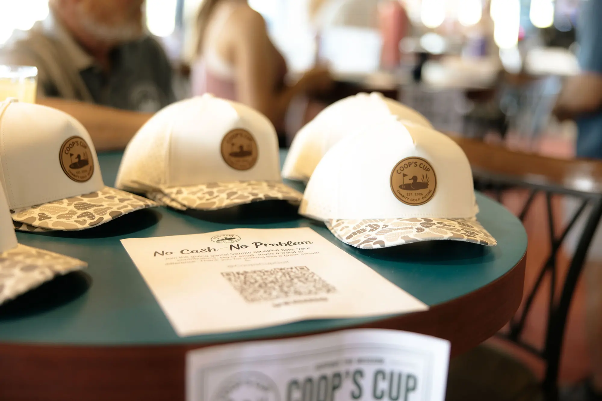 Coop's Cup hats displayed at the event